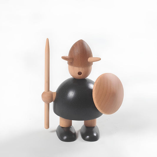 Wooden figurine of a warrior holding a spear and shield on a white background