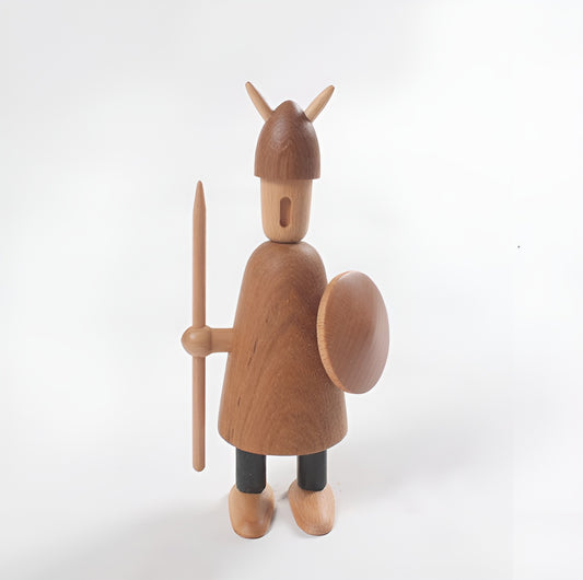 Wooden figurine of a warrior with a helmet, spear, and shield on a white background