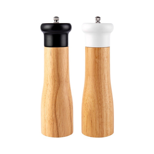 Two wooden salt and pepper shakers on a white background